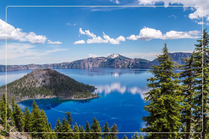 clear skies and blue waters shine at Crater Lake National Park, a dog-friendly national park where one can go hiking with dogs